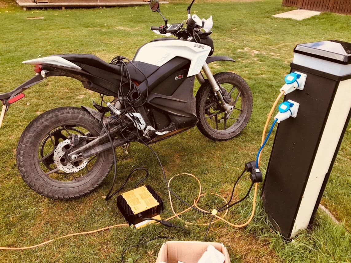 A photo of an electric motor bike being charged
