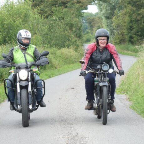 a photo of two people on two bikes